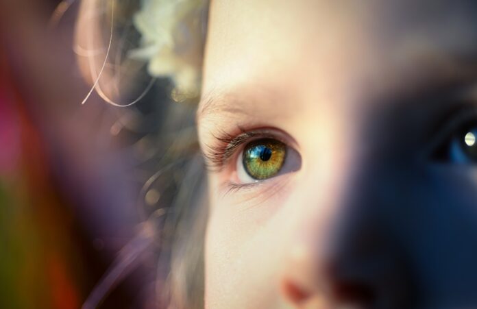 little-girl-eyes-sunshine