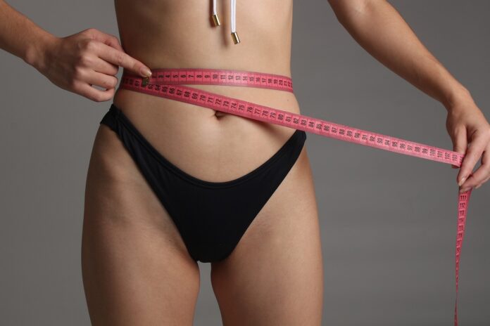 woman-mesureing-tape-weight